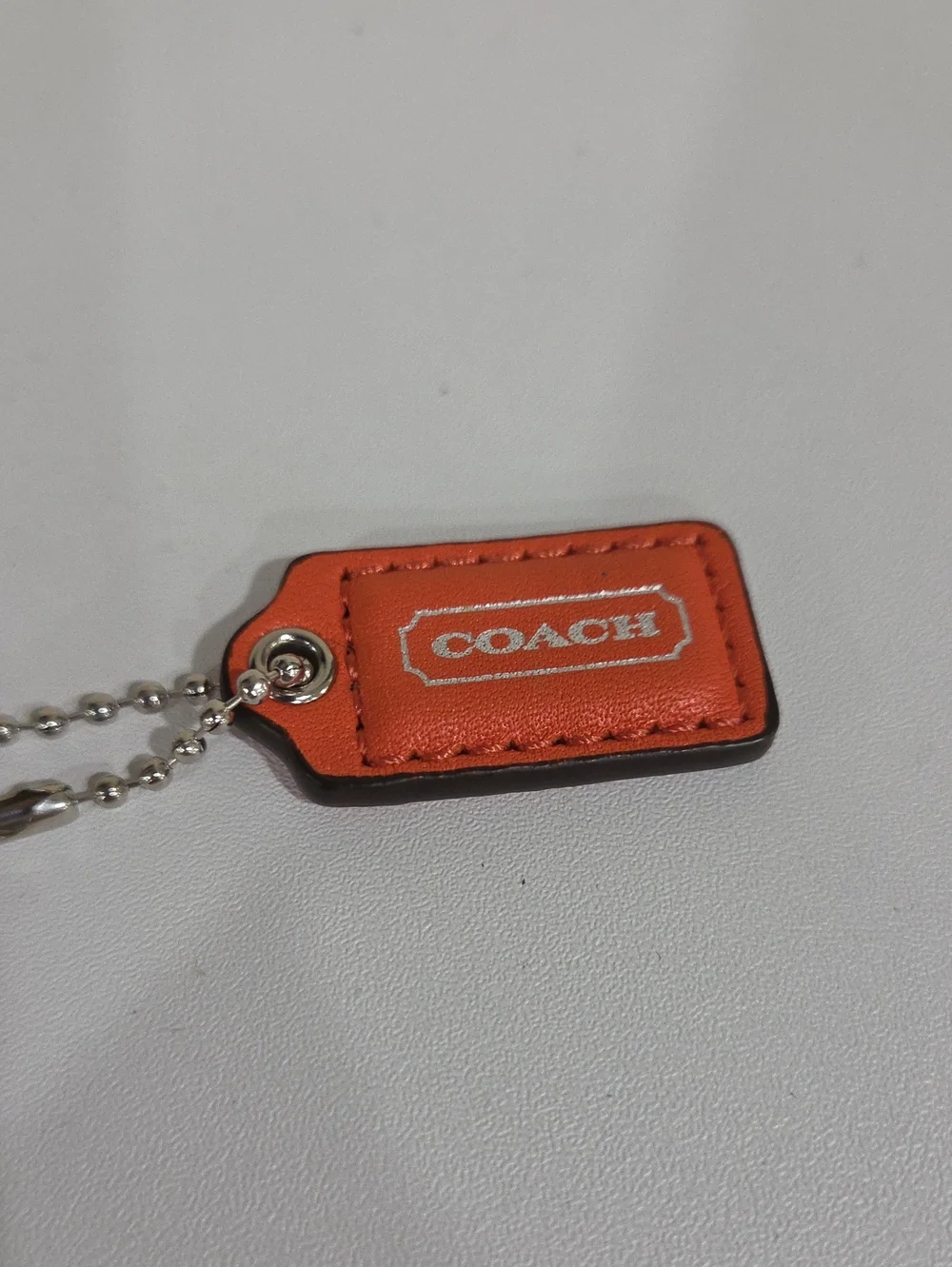 COACH Orange Leather Mini Hang  Tag  with Silver Ball Chain